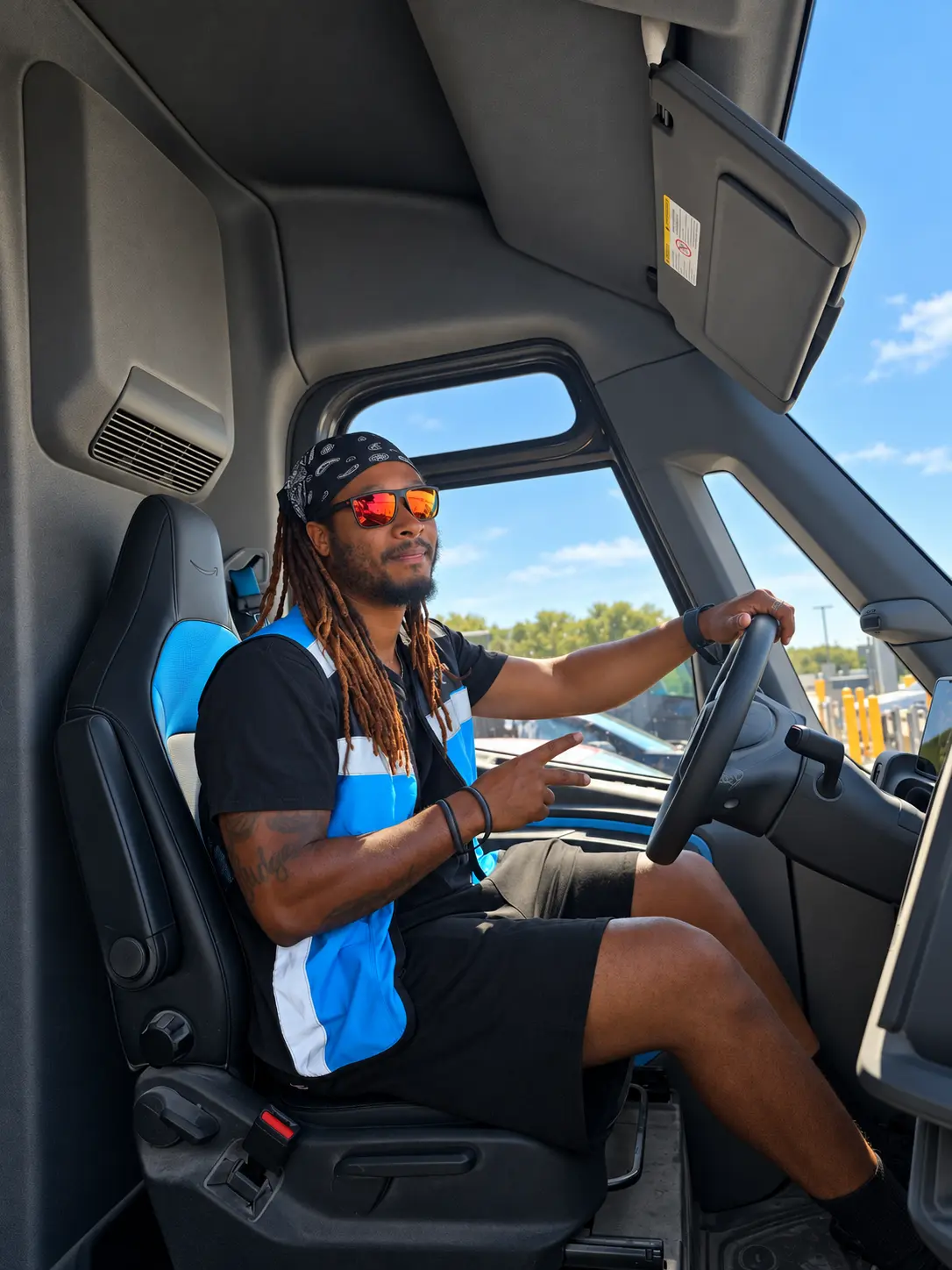 Delivery associate ready for the route inside a Rivian van