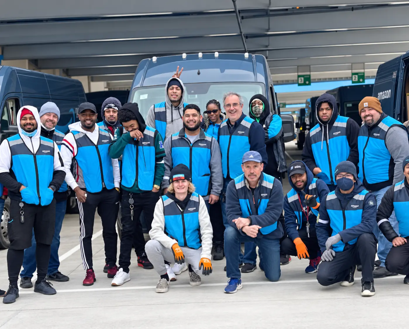Micaramy delivery team gathered in front of company vans